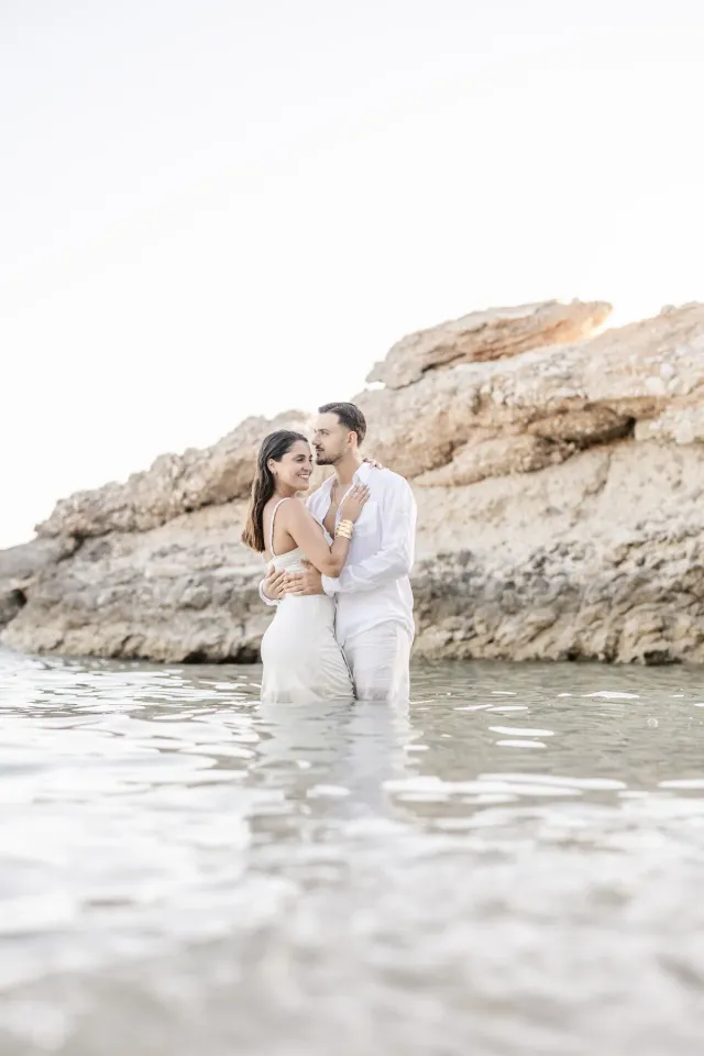 Connection in the water during a seaside engagement session