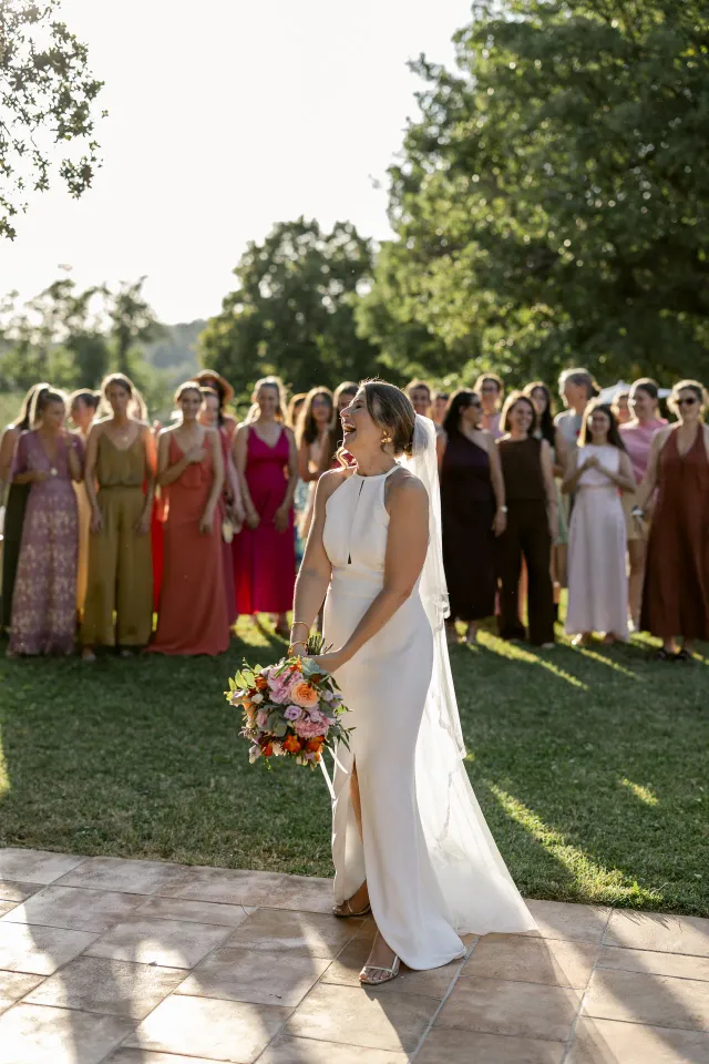 The bride surrounded by guests in the estate's grounds