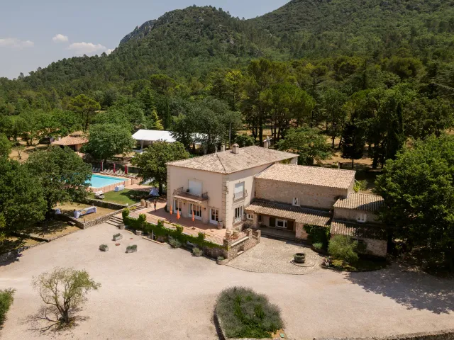 L'Escarelle estate from above, stone building and pine woods