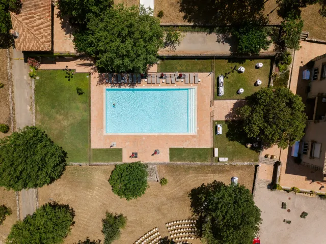 The estate's pool from above, surrounded by trees