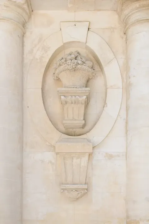 Carved stone detail on the façade of Château Martinay