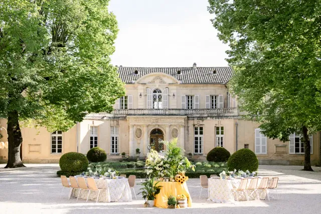 Reception tables set facing the château in the grounds