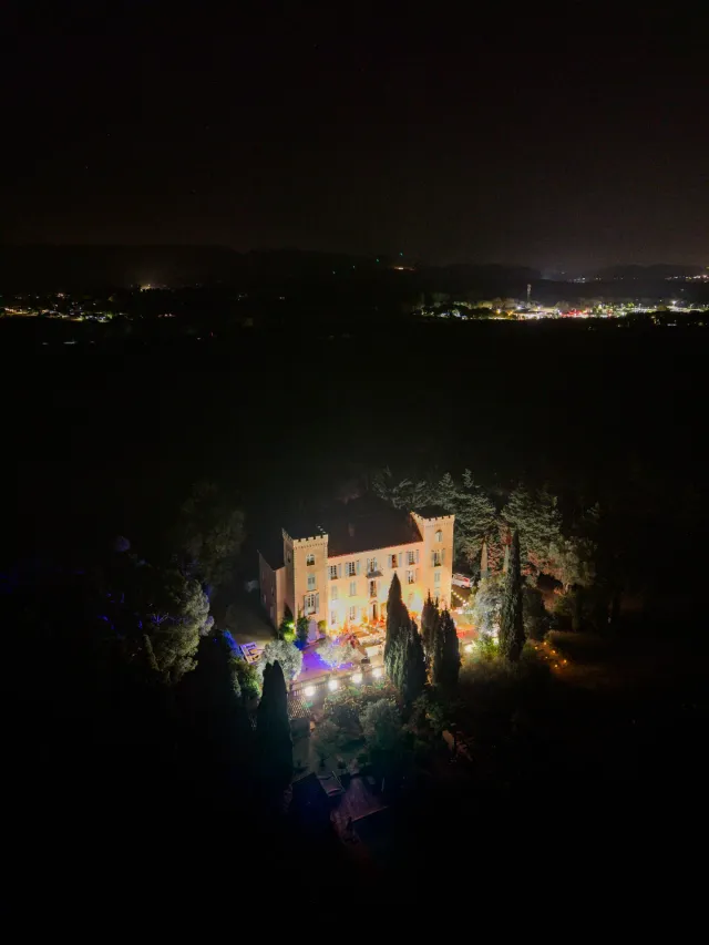 The château lit at night, aerial view over the bay