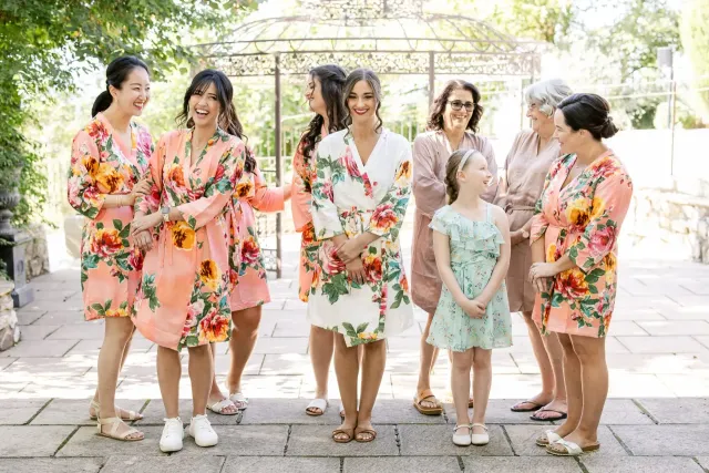 Bridesmaids in floral outfits in the courtyard