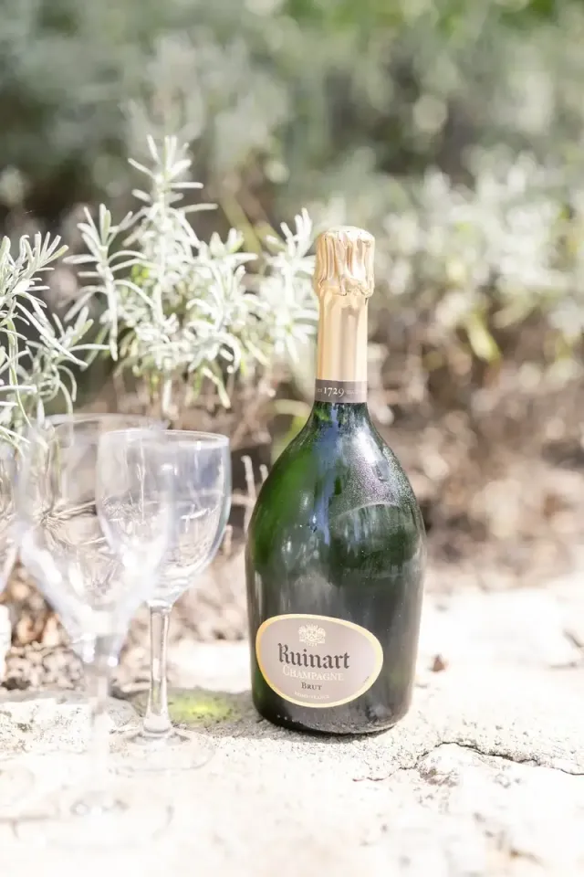 Champagne resting among dried lavender, detail from an intimate wedding in Provence